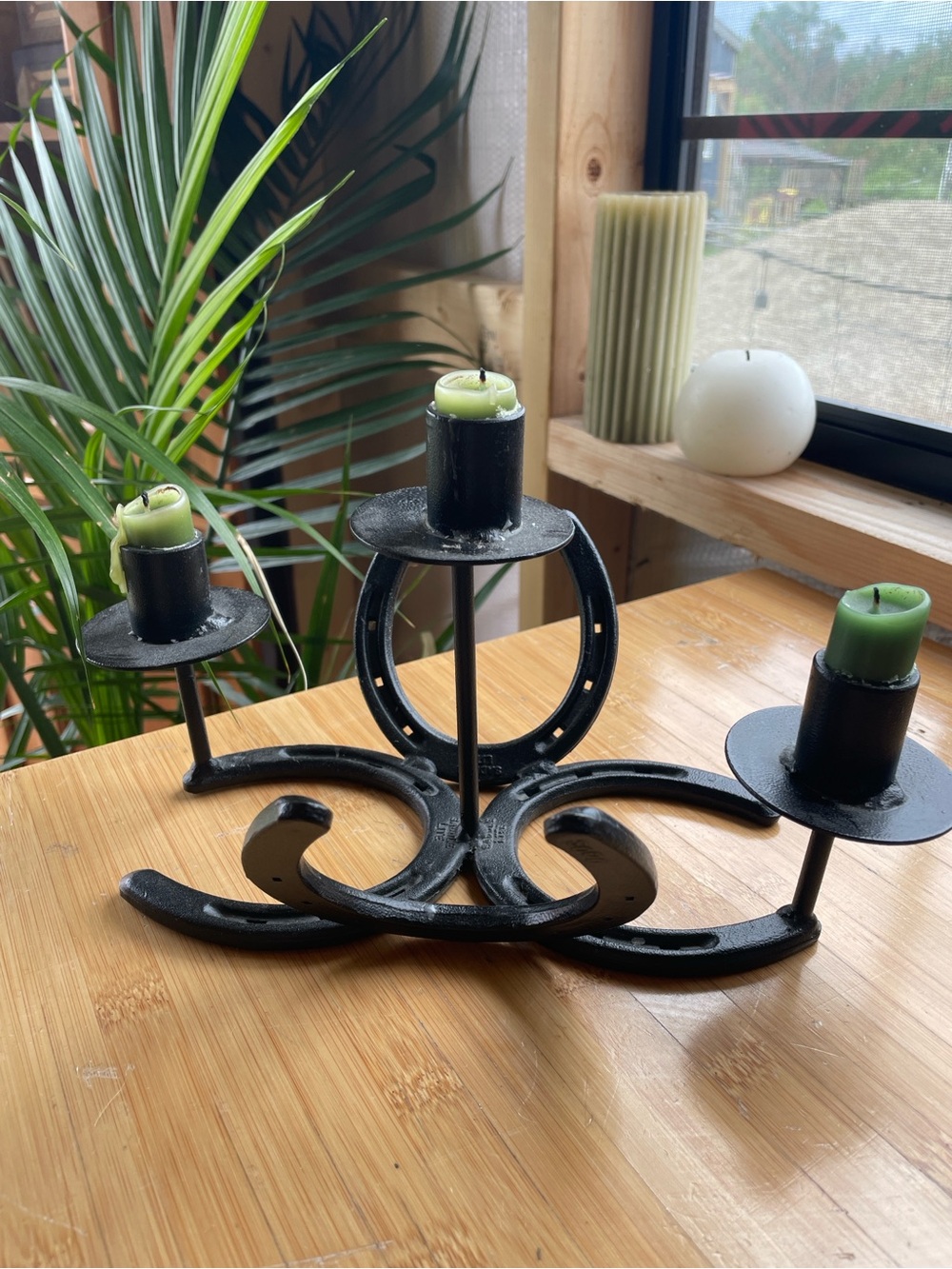 Black Horseshoe Iron Candle Holder with Green Candles